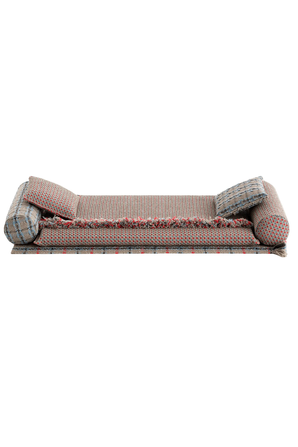 GAN Rugs Garden Layers Composition 05, a modern modular outdoor sofa or daybed featuring a durable woven outdoor fabric in a unique beige base with red and blue speckled patterns and fringed edges.