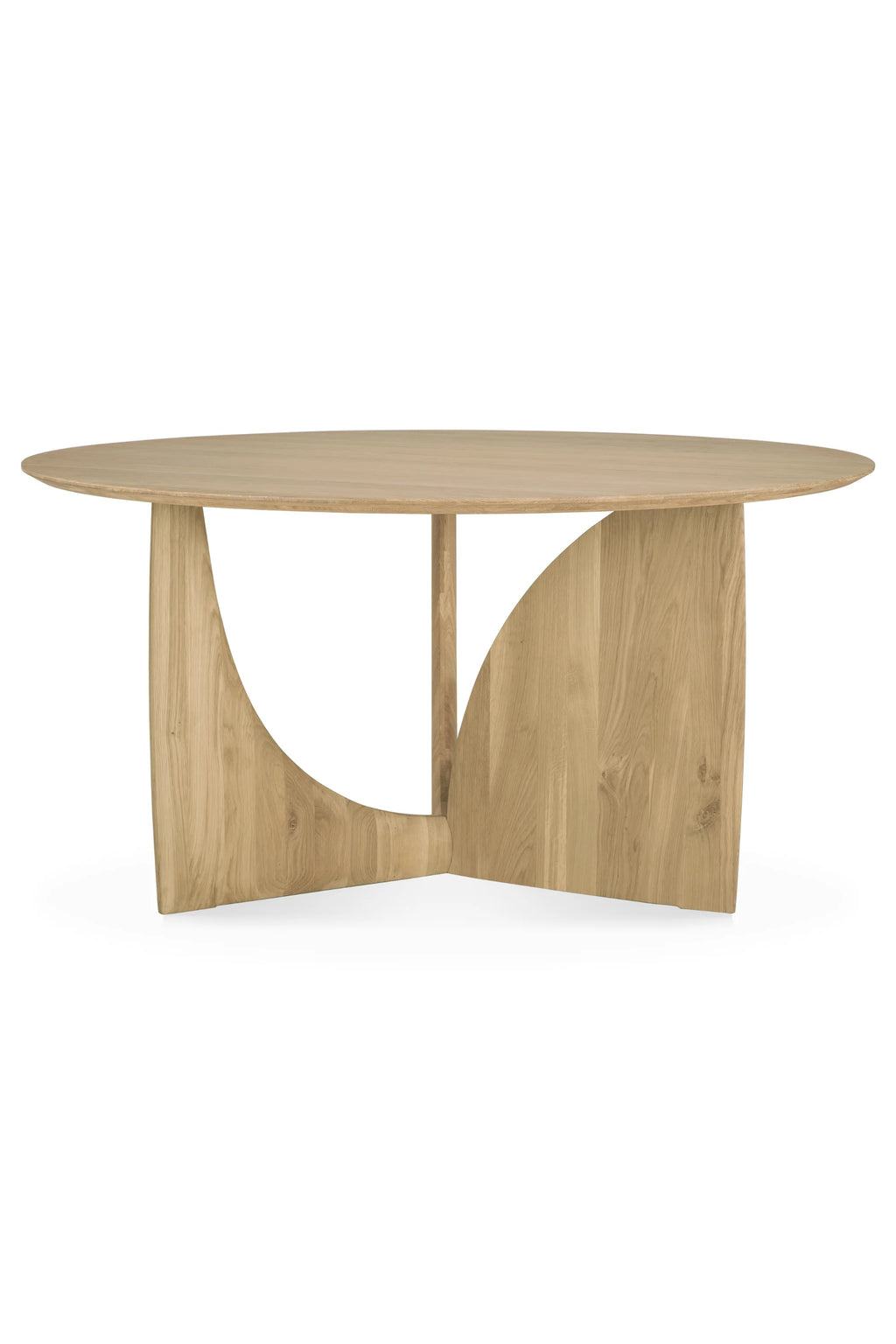 Ethnicraft Geometric Round Dining Table, a contemporary organic modern dining table crafted from light natural solid oak wood with a smooth finish and visible grain. It features a striking sculptural geometric base composed of three interlocking curved panels supporting a sleek round tabletop. Perfect as a statement piece in a minimalist dining room, modern kitchen, or open-plan living space.