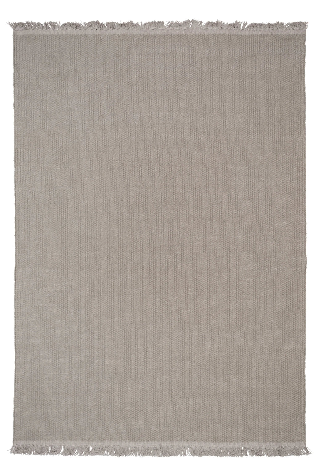 Linie Design Pastoral Unity Wool Rug, a hand-woven wool area rug featuring a subtle light greige hue with a dense, textured flatweave construction and delicate fringed ends. This durable and versatile neutral rug offers an organic modern aesthetic, perfect for anchoring a Scandinavian living room, minimalist bedroom, or cozy contemporary space.