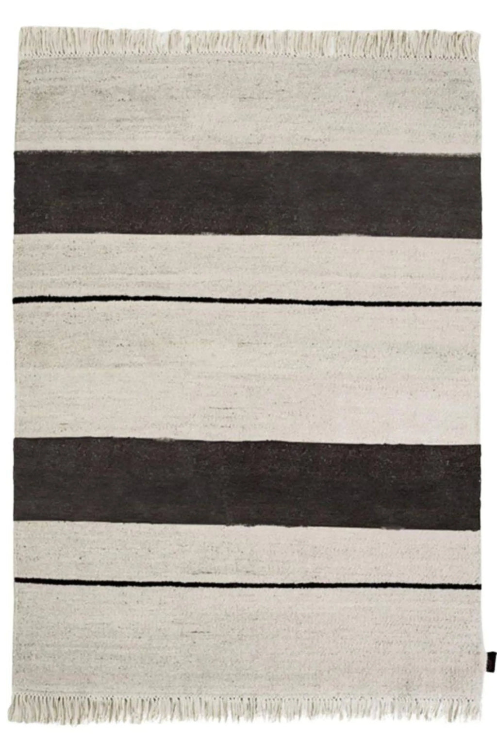 Sera Helsinki Aava Rug, a hand-woven flatweave area rug featuring bold horizontal stripes in natural cream and dark charcoal grey, accented with thin black lines and soft fringed ends. This minimalist Scandinavian wool rug is perfect for adding a graphic yet organic touch to modern living rooms, bedrooms, or japandi-inspired spaces.