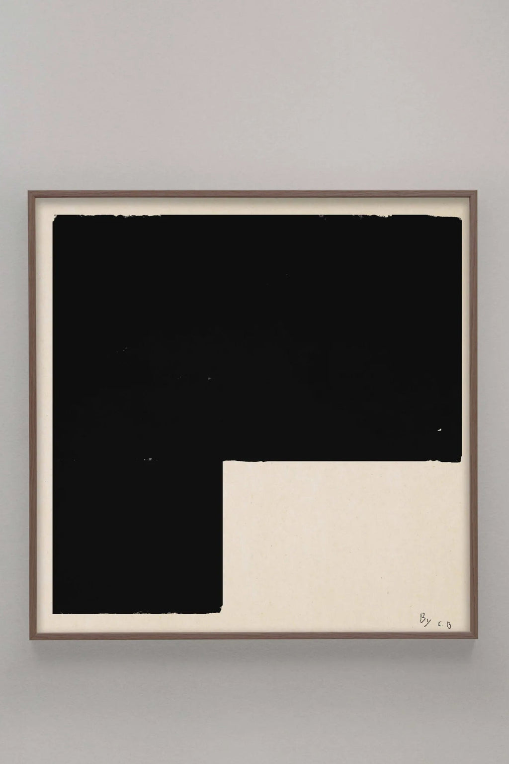 The Poster Club Black Object 01, a striking minimalist abstract art print featuring a bold matte black geometric shape with textured brushstroke edges against a warm off-white background, presented in a sleek dark wood frame. This contemporary graphic poster is ideal for creating a focal point in modern living rooms, minimalist bedrooms, or stylish gallery walls.