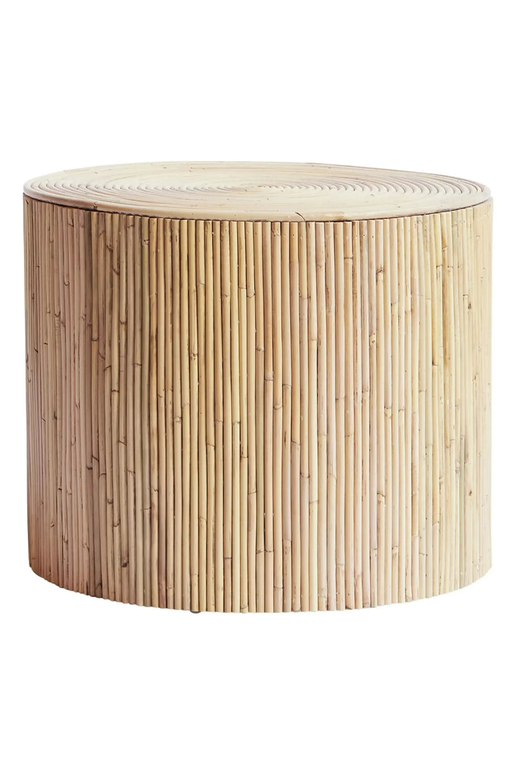 Tine K Viva Rattan Stool, a cylindrical natural rattan side table in a light beige finish, featuring a textured body of vertical rattan poles and a smooth top with concentric circular detailing. This versatile piece is perfect as a boho accent table, organic modern stool, or Scandinavian bedside table for adding natural warmth to any living room or bedroom.