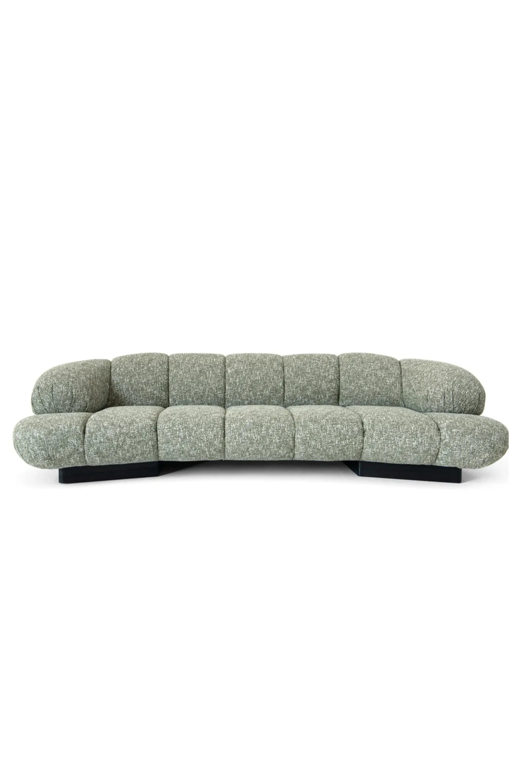 Hessentia Kiro Long Sofa, a contemporary curved sofa featuring plush, textured light green bouclé-style fabric upholstery with a distinctive channel-tufted appearance and rounded, organic silhouette. This sculptural low-profile sofa rests on a sleek matte black base, providing a striking contrast and sophisticated design.