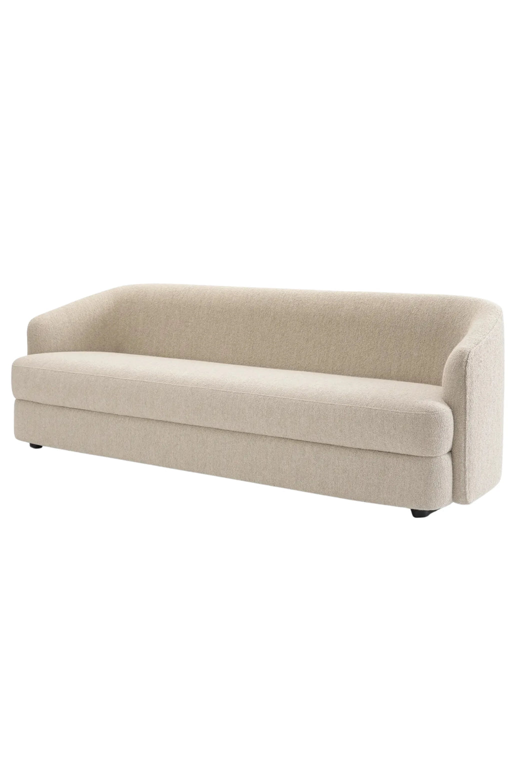New Works Covent Sofa Deep 3-Seater, a contemporary 3-seater sofa upholstered in a plush, textured beige bouclé fabric. It features a low-profile design with gently curved, organic arms and backrest, offering deep seating and clean minimalist lines. Ideal for modern living rooms, organic modern interiors, or Scandinavian-inspired spaces.