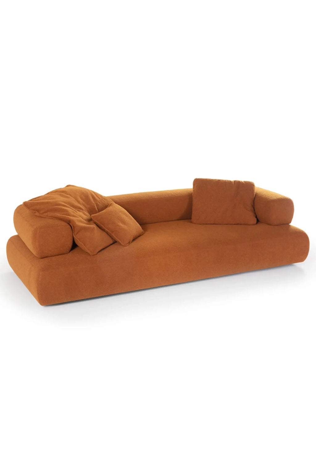 Hessentia Cholet Sofa, a luxurious low-profile modern sofa upholstered in a rich burnt orange textured fabric, featuring deep, plush seating with rounded, organic edges and loose back cushions for ultimate comfort. This contemporary lounge sofa is perfect for creating a warm, inviting focal point in modern living rooms or sophisticated lounge areas.