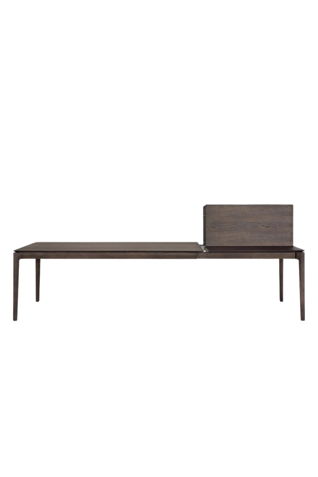 Ethnicraft Bok Extendable Dining Table, a sleek modern minimalist dining table crafted from solid dark oak wood with a rich brown finish and visible wood grain texture. This contemporary rectangular dining table features elegant tapered legs and an innovative extension mechanism for versatile seating. Ideal for Scandinavian dining rooms or open-plan living spaces seeking a functional and stylish solid wood table.