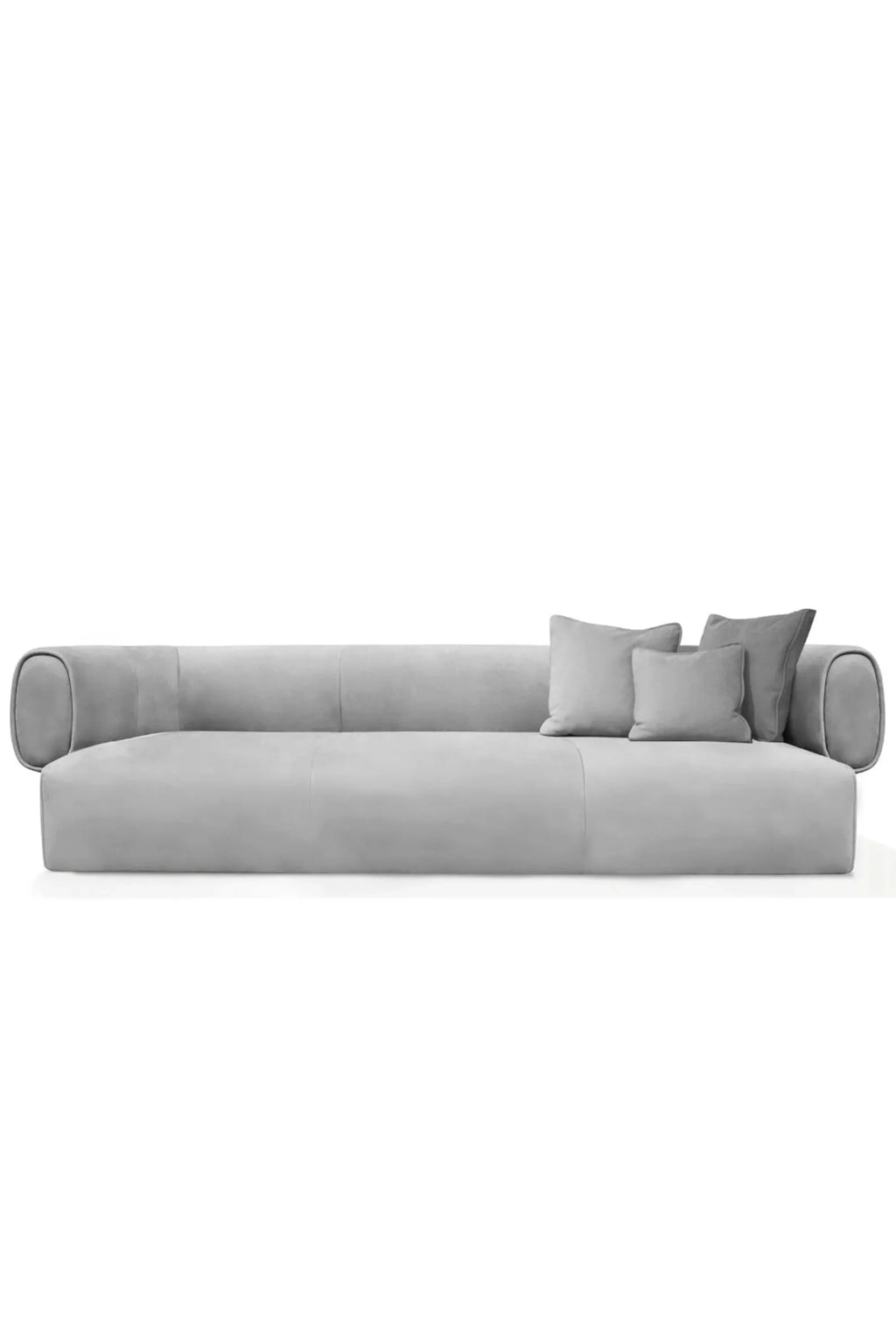 Hessentia Hug Sofa, a contemporary low-profile sofa upholstered in a soft, plush light grey fabric, featuring distinctive rounded bolster arms and deep, comfortable seating. This modern minimalist couch comes with complementary grey throw pillows, enhancing its inviting aesthetic. Ideal for a minimalist living room, modern lounge, or a spacious contemporary interior seeking both comfort and sleek design.