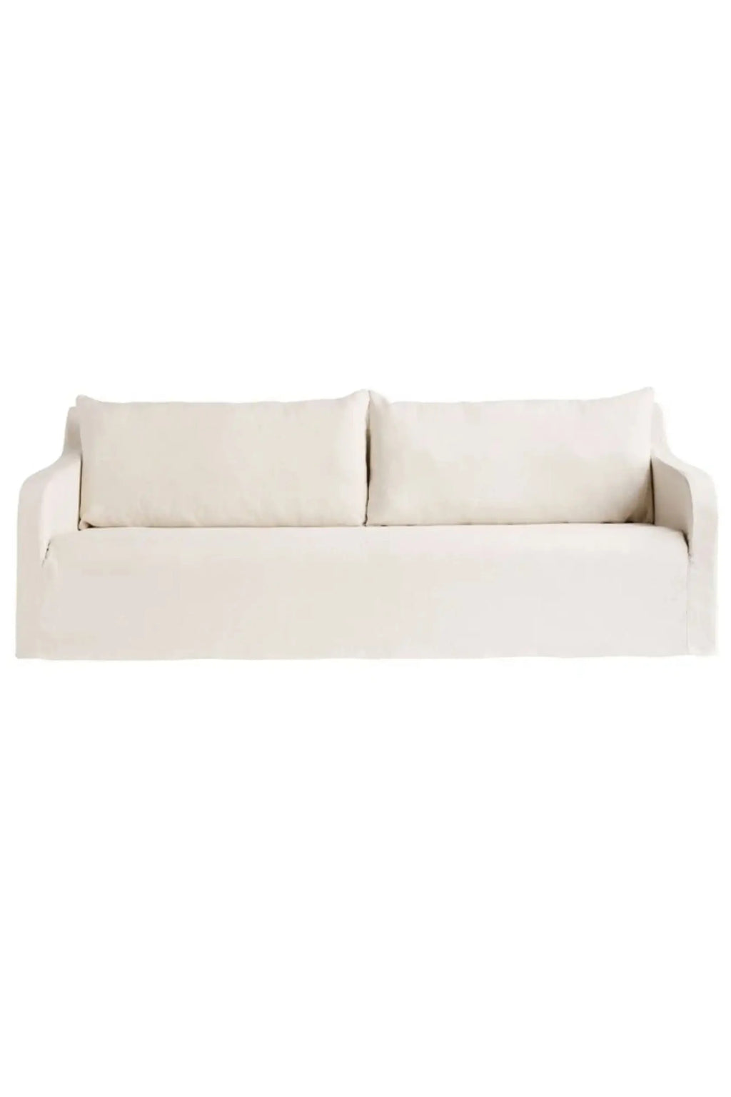Tine K Joplin Sofa, a relaxed modern sofa upholstered in a natural cream linen-blend fabric with a casual slipcover design, deep plush seating, and wide, low-profile arms. This comfortable and versatile sofa is perfect for creating a cozy atmosphere in organic modern, Scandinavian, or coastal living rooms.