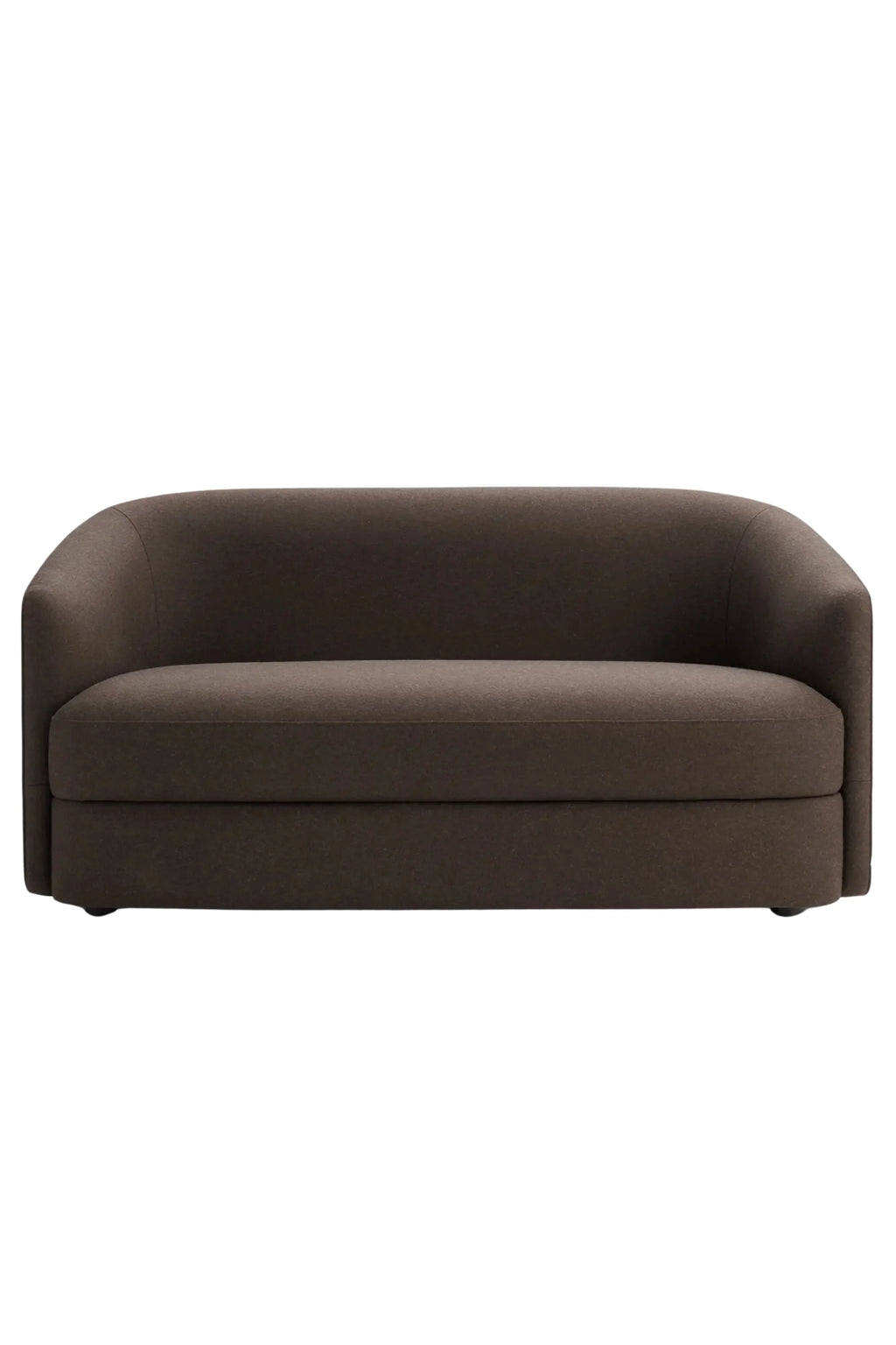 New Works Covent Sofa Narrow 2-Seater, a dark brown modern minimalist sofa upholstered in a rich, textured fabric, featuring a gracefully curved backrest and rounded arms for an organic silhouette. This compact 2-seater sofa provides comfortable seating and is ideal for contemporary living rooms, small apartments, or cozy minimalist spaces.