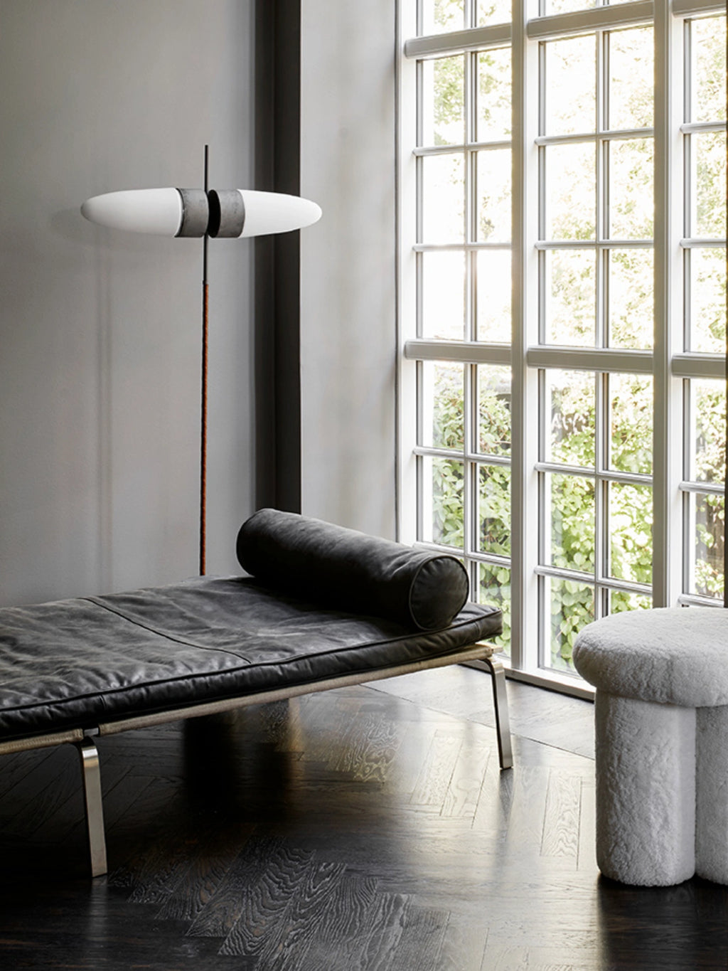 101 CPH Big Foot Stool, fluffy off-white sheepskin-upholstered stool with thick, curved legs, offering a distinctive modern organic design. Perfect for adding a soft, luxurious accent and extra seating to an elegant living room or sophisticated bedroom.