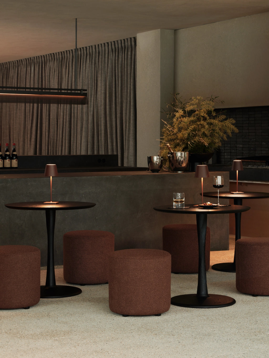 Ethnicraft Barrow Pouf, a modern cylindrical upholstered pouf in a rich rust brown textured fabric, featuring a clean, minimalist design and a plush, inviting feel. This versatile round ottoman is perfect as accent seating for contemporary living rooms, cozy bedrooms, or stylish entryways.