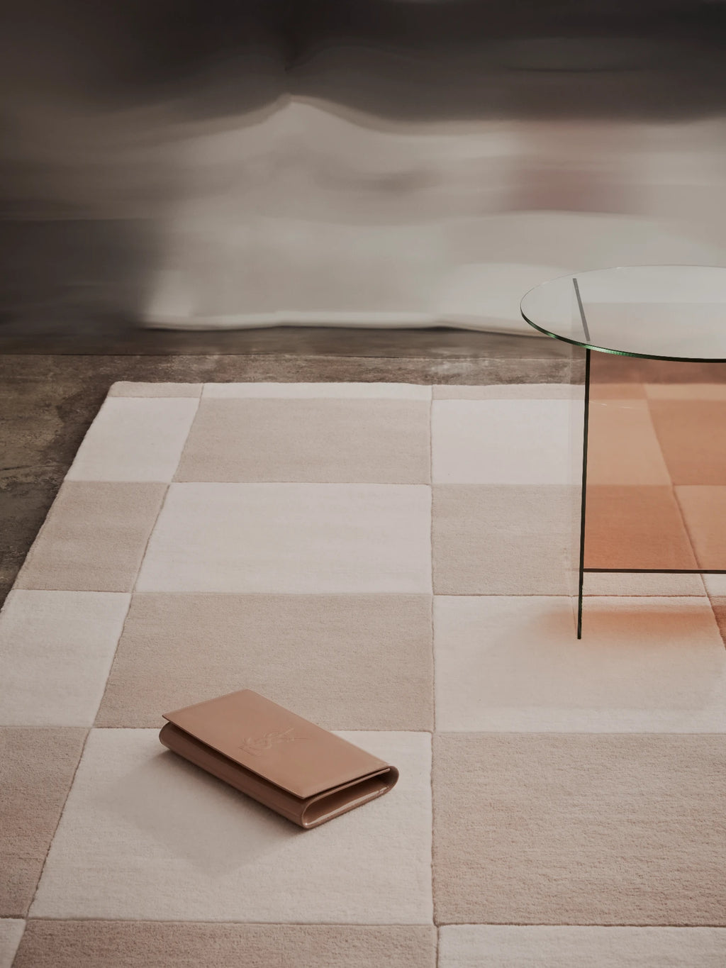 Tinted Objects Hafstrom Wool Rug, featuring a soft, plush texture with a modern checkered pattern in varying shades of cream, beige, and light brown. This stylish area rug is ideal for adding warmth and contemporary elegance to a living room or bedroom.