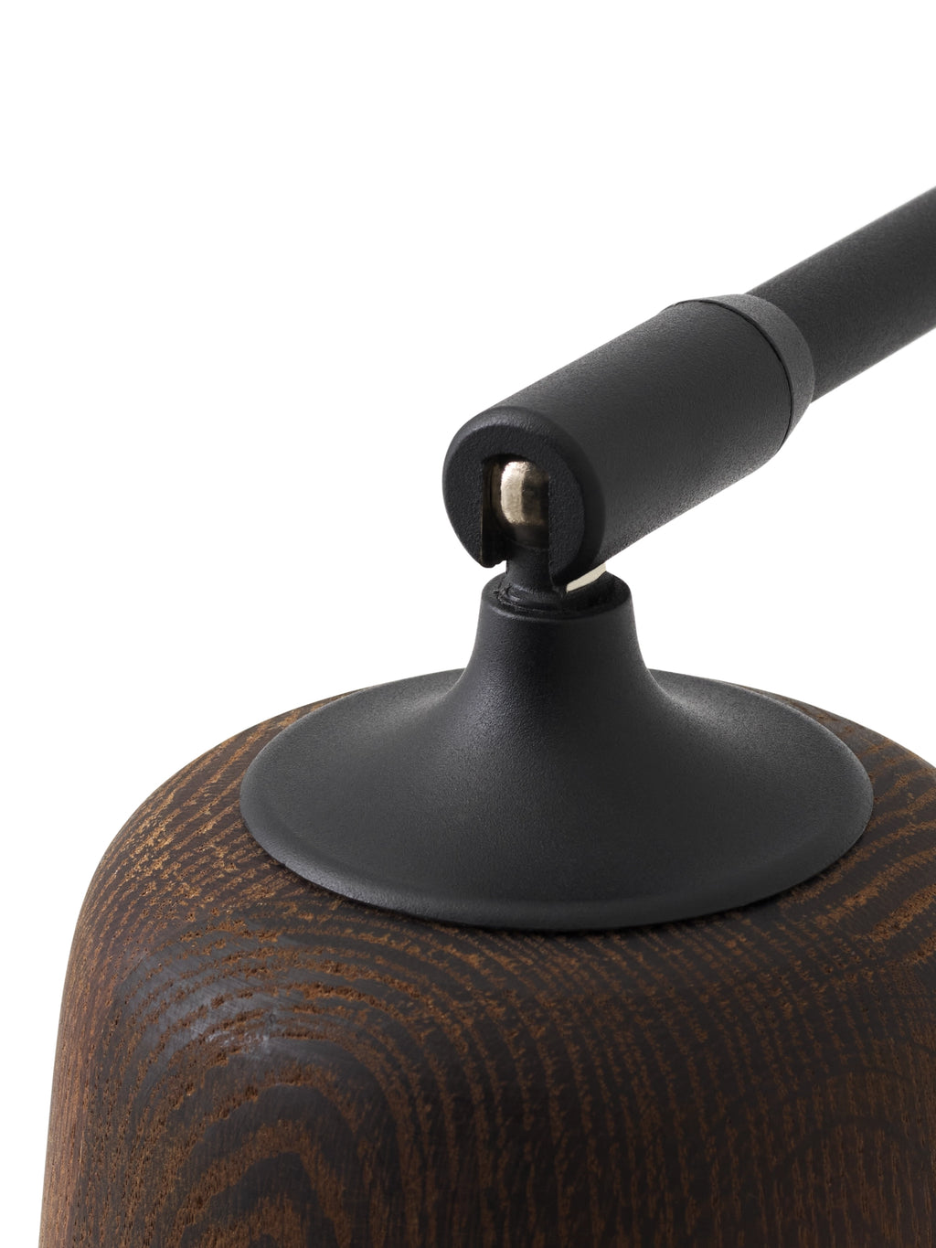 New Works Material Floor Lamp, showcasing a rich dark brown stained wood base with a pronounced natural grain texture and a matte black metal adjustable joint connecting to the lamp arm.