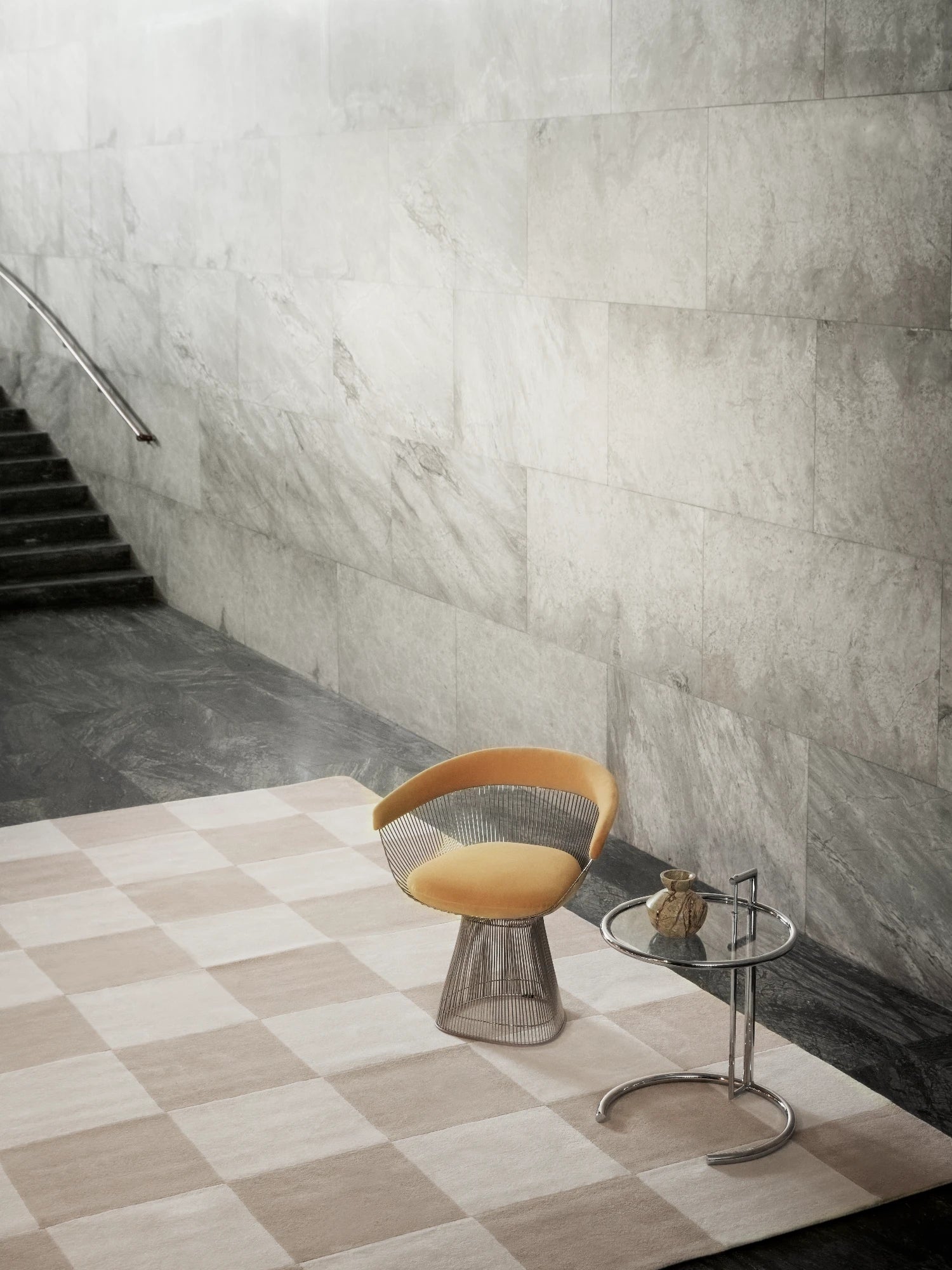 Tinted Objects Hafstrom Wool Rug, featuring a checkerboard pattern with alternating light beige and cream squares. This luxurious, soft texture rug is perfect for adding warmth and a modern aesthetic to contemporary living spaces or entryways.