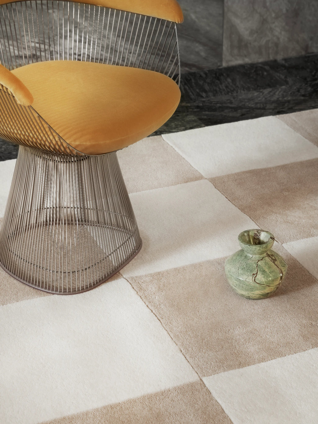 Tinted Objects Hafstrom Wool Rug, featuring a modern checkerboard pattern in soft beige and off-white squares with a plush, luxurious texture. This stylish area rug is perfect for adding warmth and contemporary elegance to living rooms or bedrooms for design-conscious homeowners.