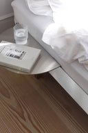  Minimalist stainless steel bed frame with low profile and industrial-inspired design