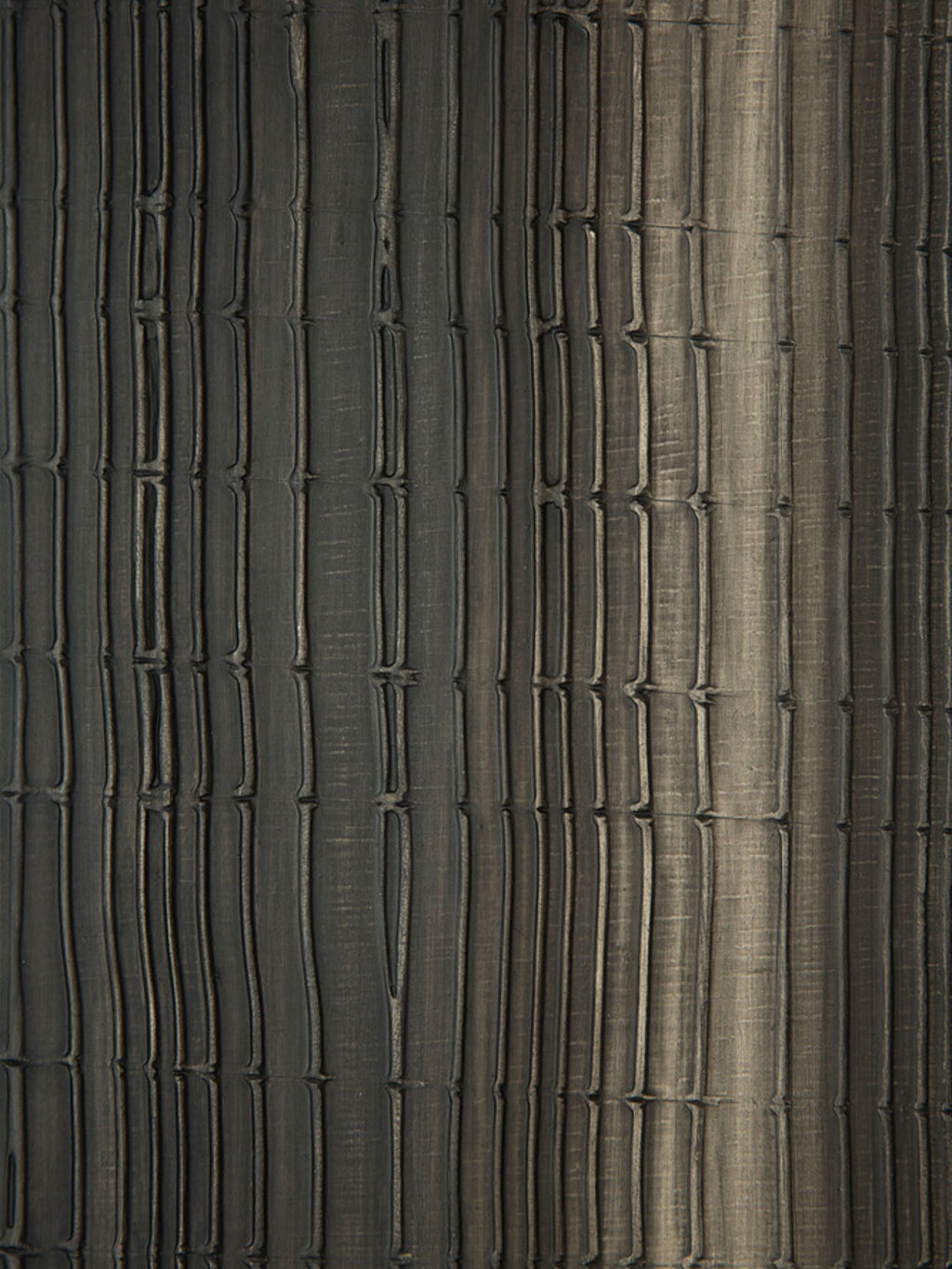 Ethnicraft Layered Clay Wall Art, a dark grey textured wall art panel featuring a deeply carved relief surface with irregular vertical lines and horizontal segments, reminiscent of stacked bamboo or organic wood slats. The matte charcoal finish with subtle lighter grey and brown undertones creates a distressed, natural clay aesthetic. Perfect as a statement piece of organic modern wall decor for living rooms, bedrooms, or contemporary minimalist interiors seeking a wabi-sabi touch.
