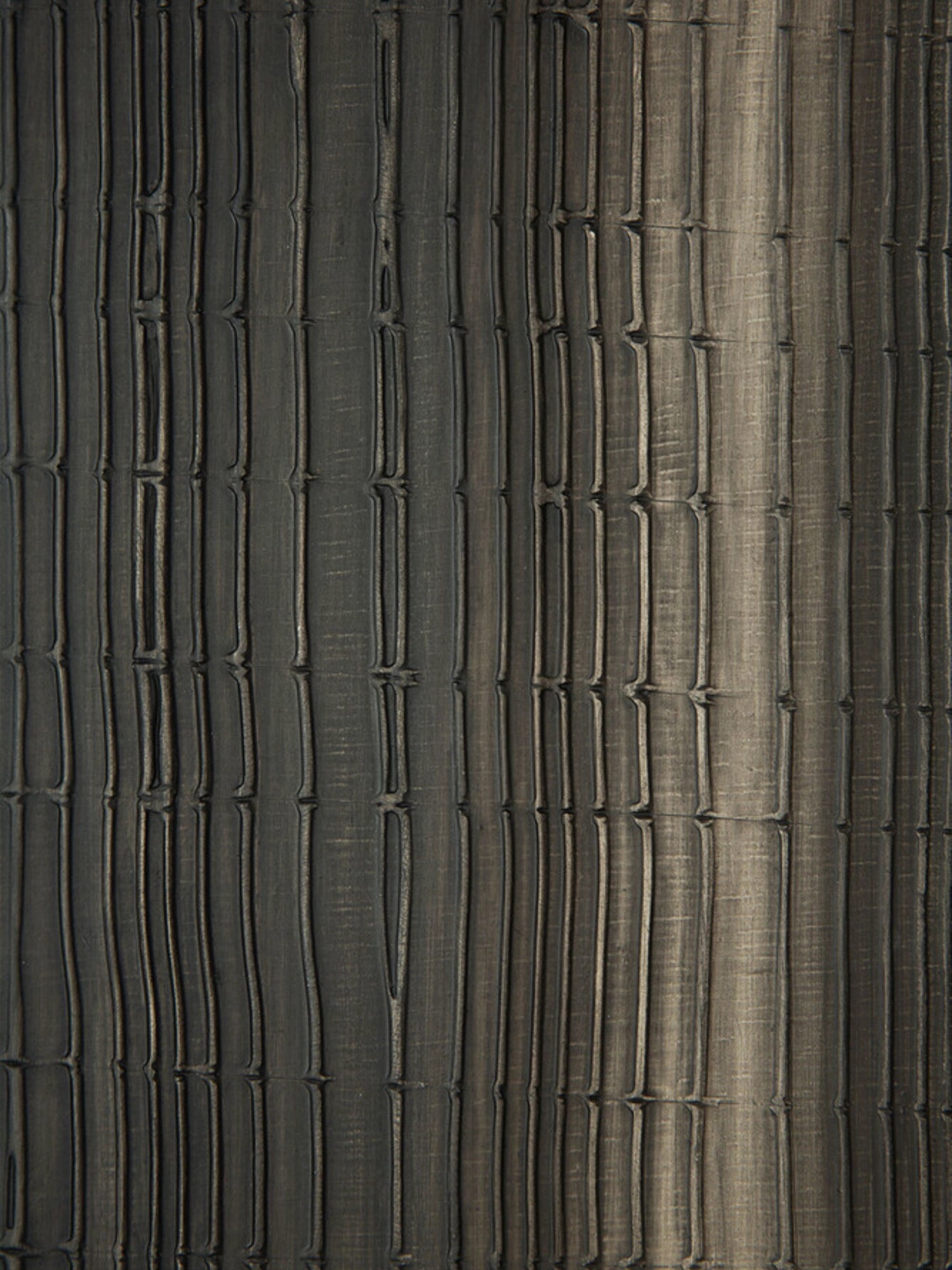 Ethnicraft Layered Clay Wall Art, a dark grey textured wall art panel featuring a deeply carved relief surface with irregular vertical lines and horizontal segments, reminiscent of stacked bamboo or organic wood slats. The matte charcoal finish with subtle lighter grey and brown undertones creates a distressed, natural clay aesthetic. Perfect as a statement piece of organic modern wall decor for living rooms, bedrooms, or contemporary minimalist interiors seeking a wabi-sabi touch.