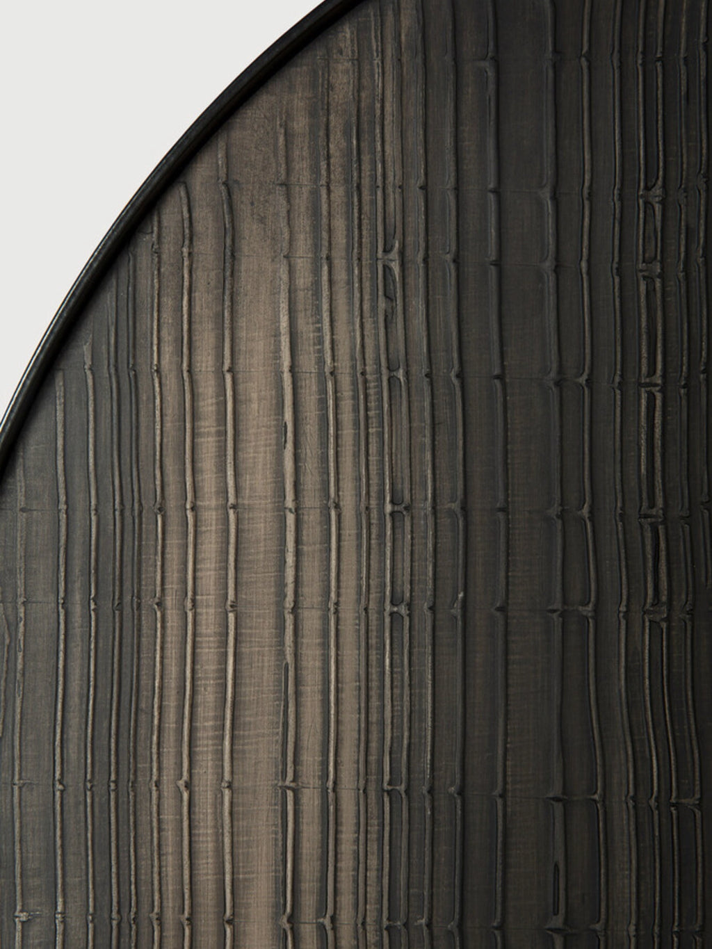 Ethnicraft Layered Clay Wall Art, a dark grey-brown wall hanging featuring a deeply textured surface with organic vertical grooves and subtle horizontal irregularities, creating a hand-carved, bamboo-like.