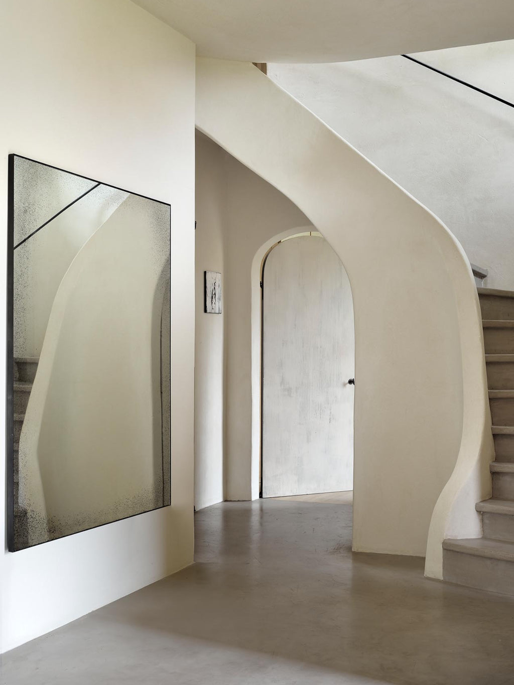 Ethnicraft Aged Wall Mirror, a large rectangular decorative mirror featuring a unique distressed and antiqued glass surface with speckled silver tones and a slim black metal frame, enhanced by an internal diagonal line creating a subtle geometric effect. Perfect as a modern minimalist entryway mirror or for adding industrial chic style to living rooms and bedrooms.