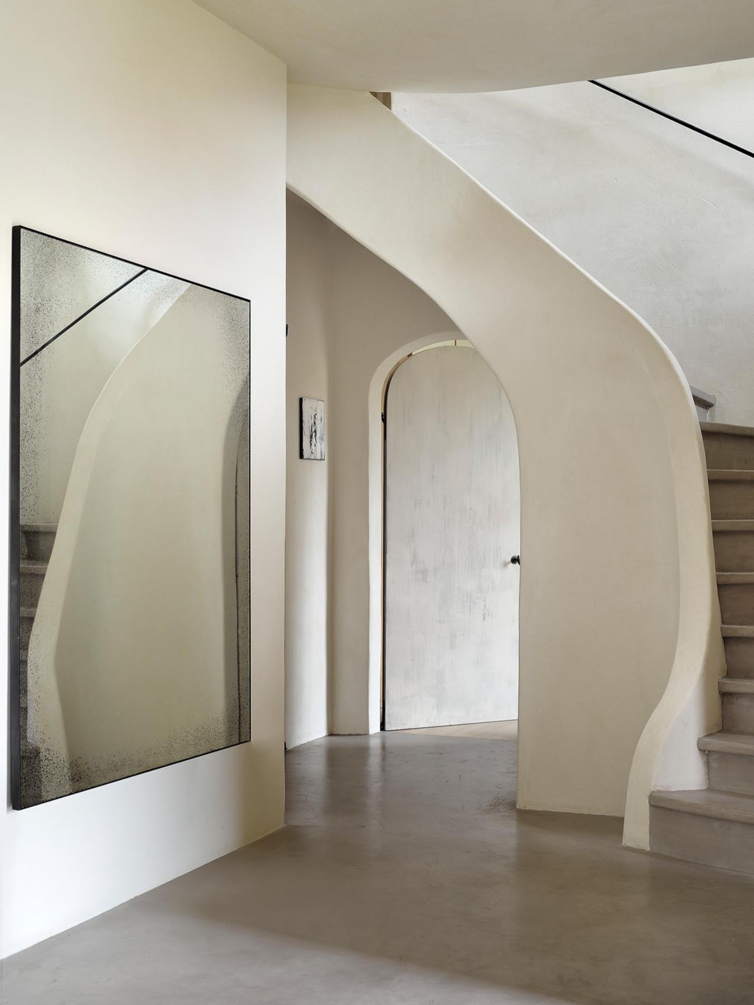 Ethnicraft Aged Wall Mirror, a large rectangular decorative mirror featuring a unique distressed and antiqued glass surface with speckled silver tones and a slim black metal frame, enhanced by an internal diagonal line creating a subtle geometric effect. Perfect as a modern minimalist entryway mirror or for adding industrial chic style to living rooms and bedrooms.