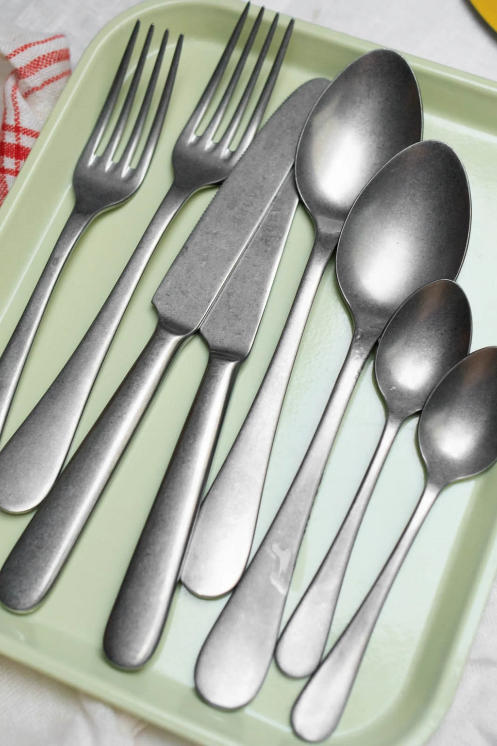 Sabre Paris Marius 5-Piece Cutlery Flatware Set, featuring durable brushed stainless steel with an antique pewter finish and sleek, minimalist design. This elegant flatware set is perfect for enhancing everyday dining or special occasions for those who appreciate modern, sophisticated table settings.