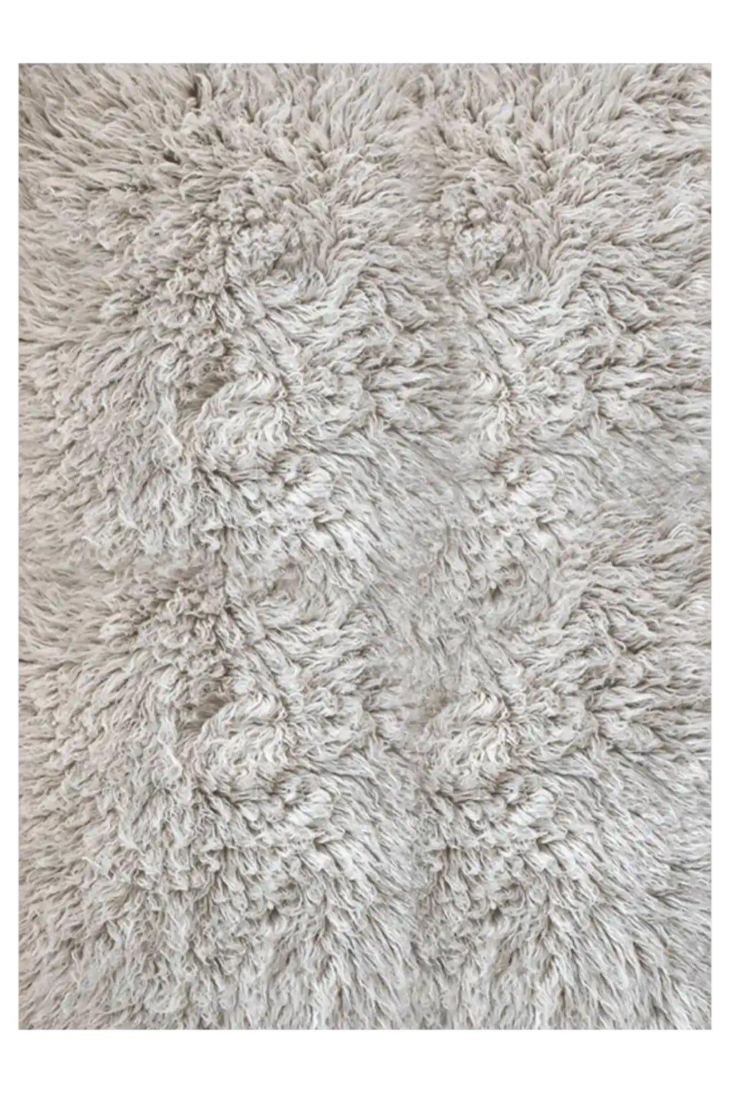 Layered Shaggy Rug, a thick, plush, light grey faux fur area rug with a soft, textured pile. Perfect for adding warmth and comfort to any living room or bedroom space.