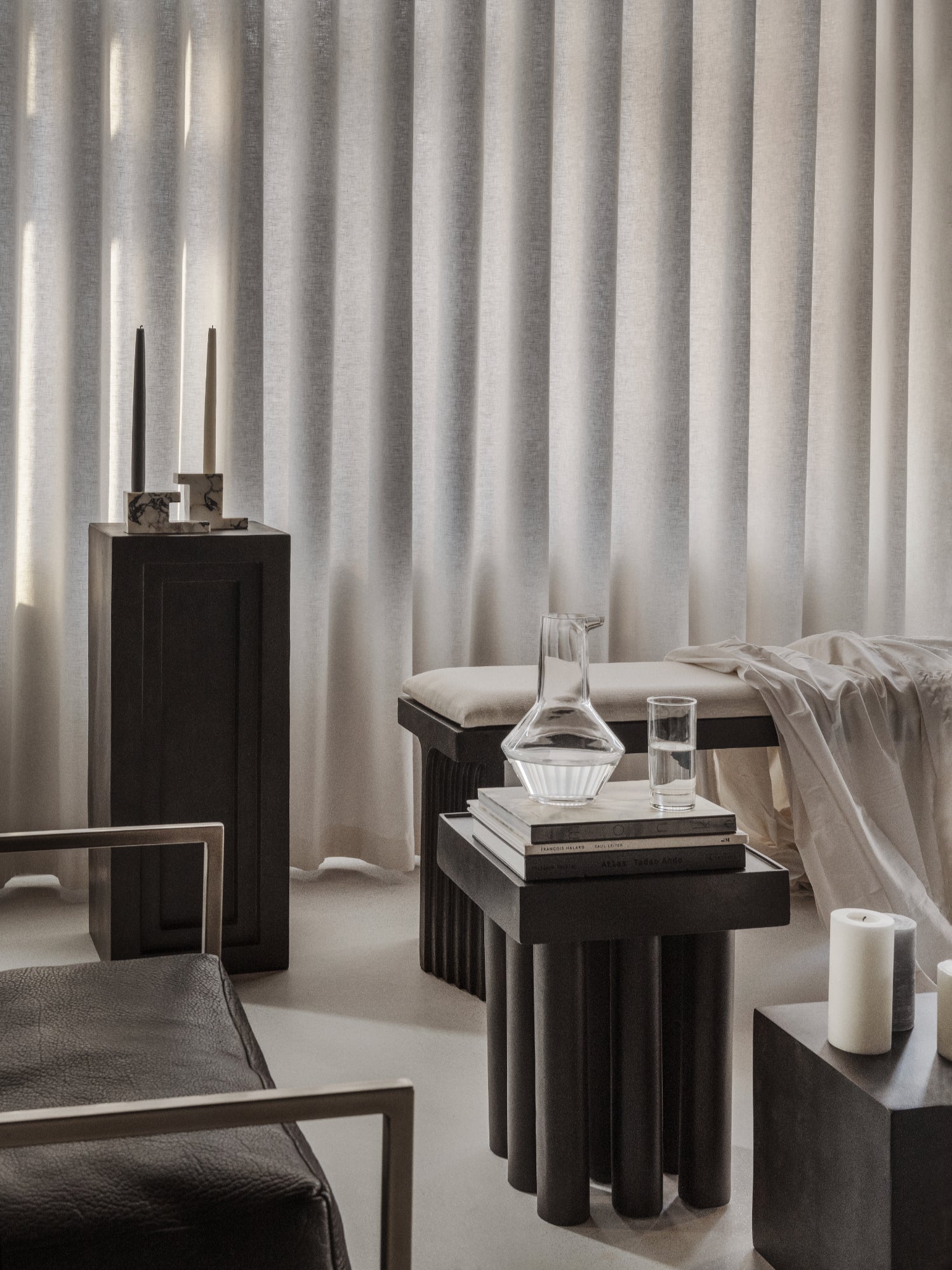 101 CPH Brick Candle Holder - Calacatta. Two handcrafted white and black marbled Calacatta marble candle holders, styled with long black and ivory candles on a dark pillar. A luxury home accent.