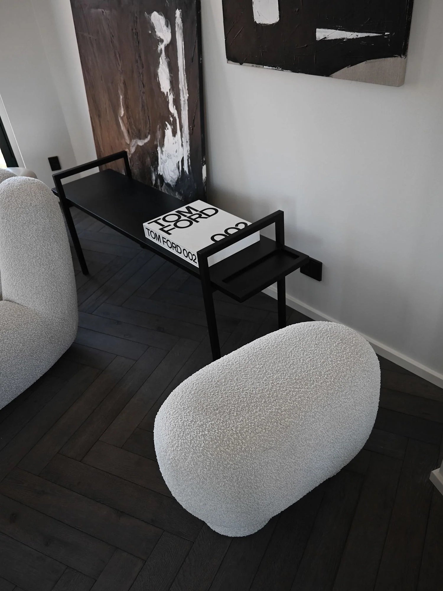 101 CPH Petit Big Foot Bench - Boucle in a lifestyle setting, showcasing its unique, organic egg shape upholstered in premium white boucle fabric. Ideal for adding a luxurious touch to any living space.