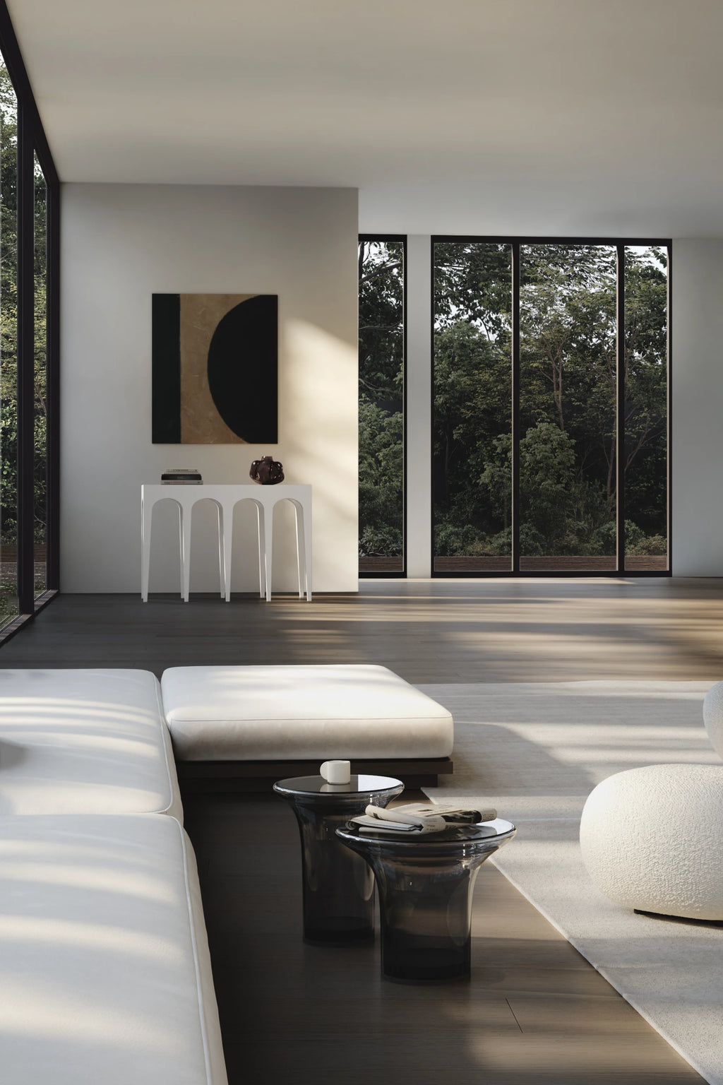 101 CPH Trumpet Coffee Table Set - Glass, featuring two modern smoked grey glass tables with clear tops, displayed in a bright, spacious living room beside a cream sofa. A premium, contemporary accent for any luxurious home.