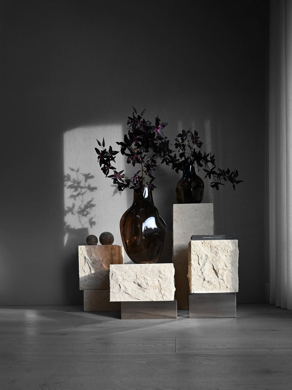 101 CPH Temple Side Table in a lifestyle setting, showcasing its distressed cream limestone blocks and sleek silver metal base. A luxurious and authentic statement piece for any modern interior.