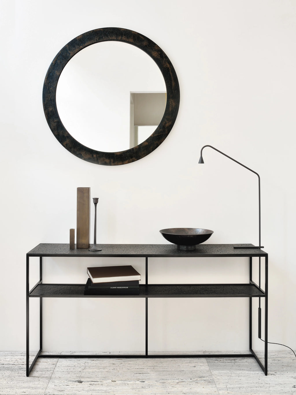 Ethnicraft Sphere Wall Mirror, a large round wall mirror featuring a heavily textured and distressed dark bronze metal frame with an organic, almost cracked finish. This industrial chic mirror provides a unique, rustic modern accent with its deep, earthy tones and tactile surface. Perfect as a statement decorative mirror for an entryway, living room, or contemporary bedroom.