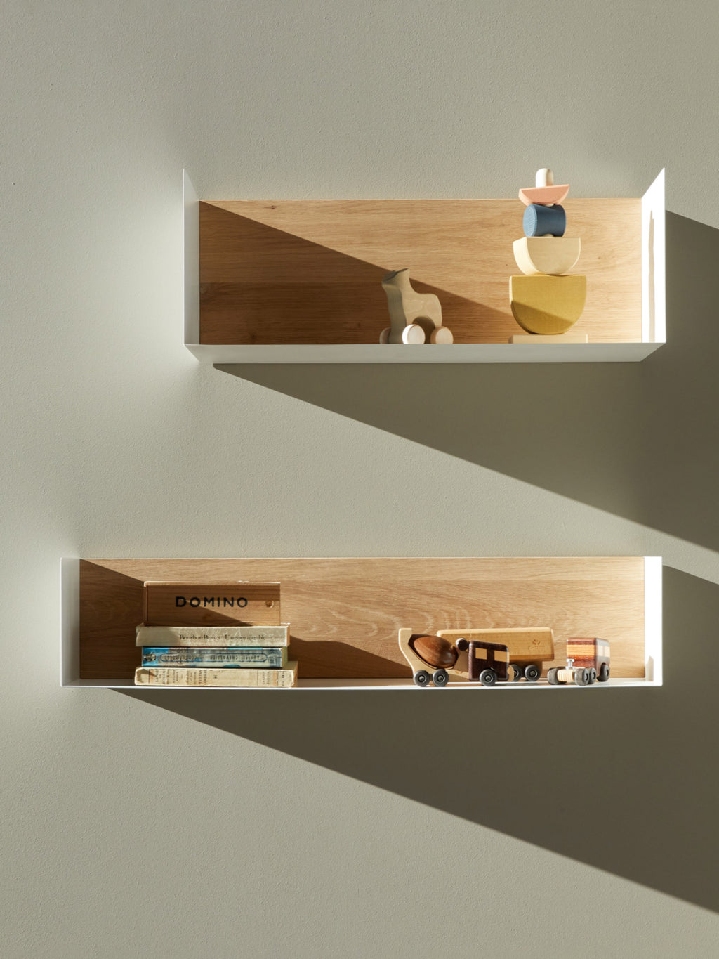 Ethnicraft U Shelf, a modern minimalist wall shelf featuring a clean white U-shaped metal frame with a contrasting natural solid oak wood interior. This contemporary floating shelf offers sleek display storage with Scandinavian design appeal and a warm, organic modern aesthetic. Ideal for living room shelf styling, bedroom accents, or a chic home office display.