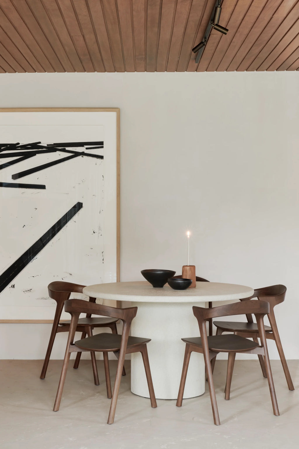 Ethnicraft Elements Dining Table, a round organic modern dining table featuring a light cream textured stone finish on both its circular top and substantial cylindrical base. This contemporary minimalist dining table is perfect for modern dining rooms or spacious kitchen areas, offering a refined, natural aesthetic for design-conscious homes.