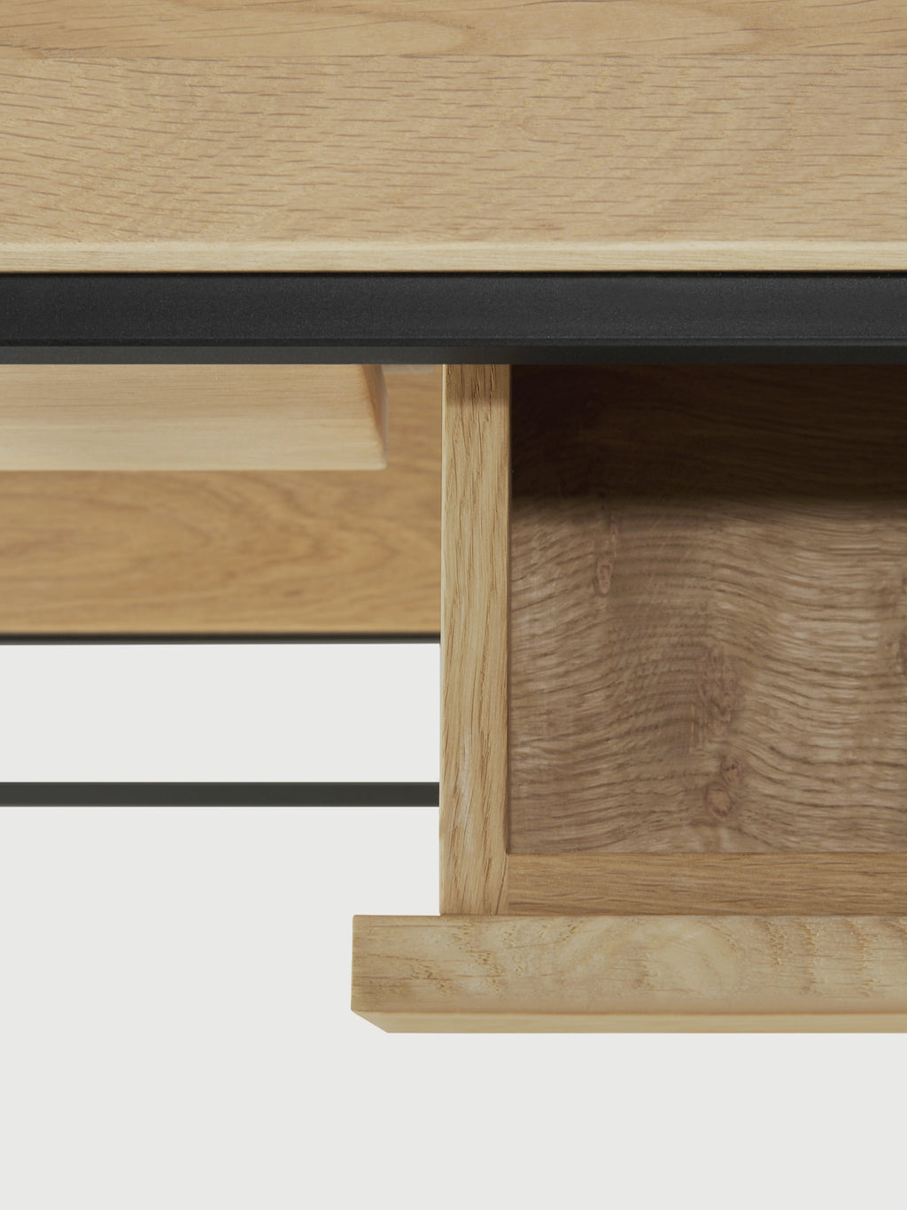 Ethnicraft Monolit Console, a sleek modern console table crafted from natural solid oak wood, showcasing a prominent grain texture and clean lines, accented by a subtle matte black metal detail. This Scandinavian-inspired piece features an integrated drawer, offering practical storage for minimalist entryways or contemporary living rooms.