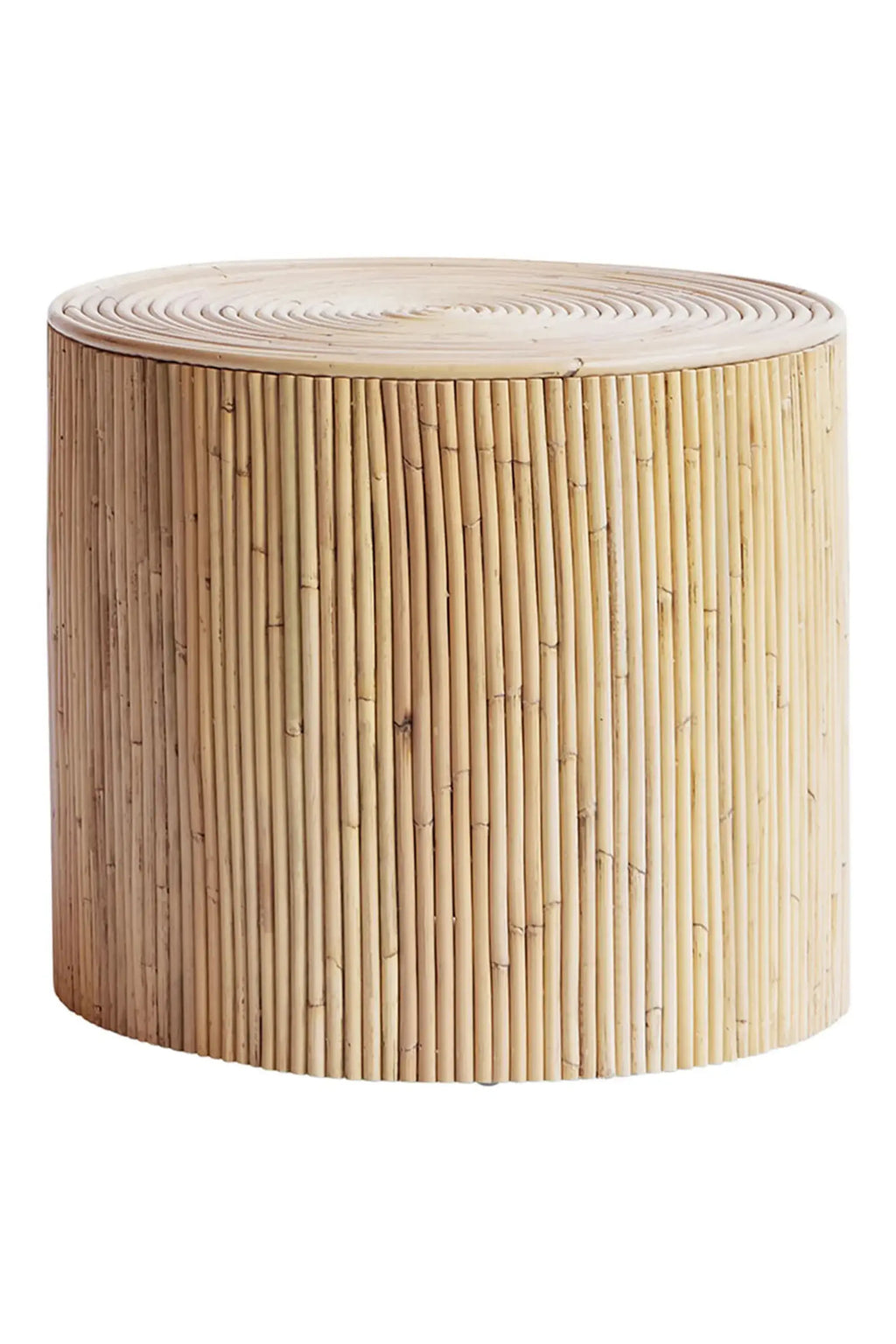 Tine K Viva Rattan Stool, a versatile natural rattan cylindrical side table crafted from light beige vertical rattan poles and a round top featuring concentric rattan circles. This organic modern accent table offers a warm, textured look with its handcrafted appeal. Perfect as a boho side table for a living room, coastal bedroom accent, or natural outdoor patio furniture.