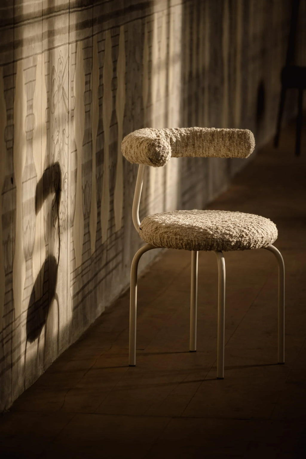NG DESIGN Object 114 Chair, a premium modern chair with looped beige textured upholstery on the backrest and seat, and a simple cream metal frame, displayed in a sunlit room. Ideal for minimalist interiors.