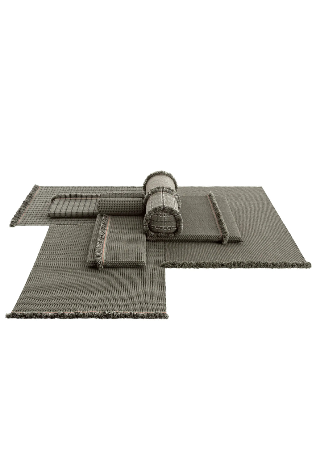 GAN Rugs Garden Layers Composition 04, a modular olive green outdoor sofa system featuring multiple woven textile elements with varied textures including herringbone, waffle, and plaid patterns.
