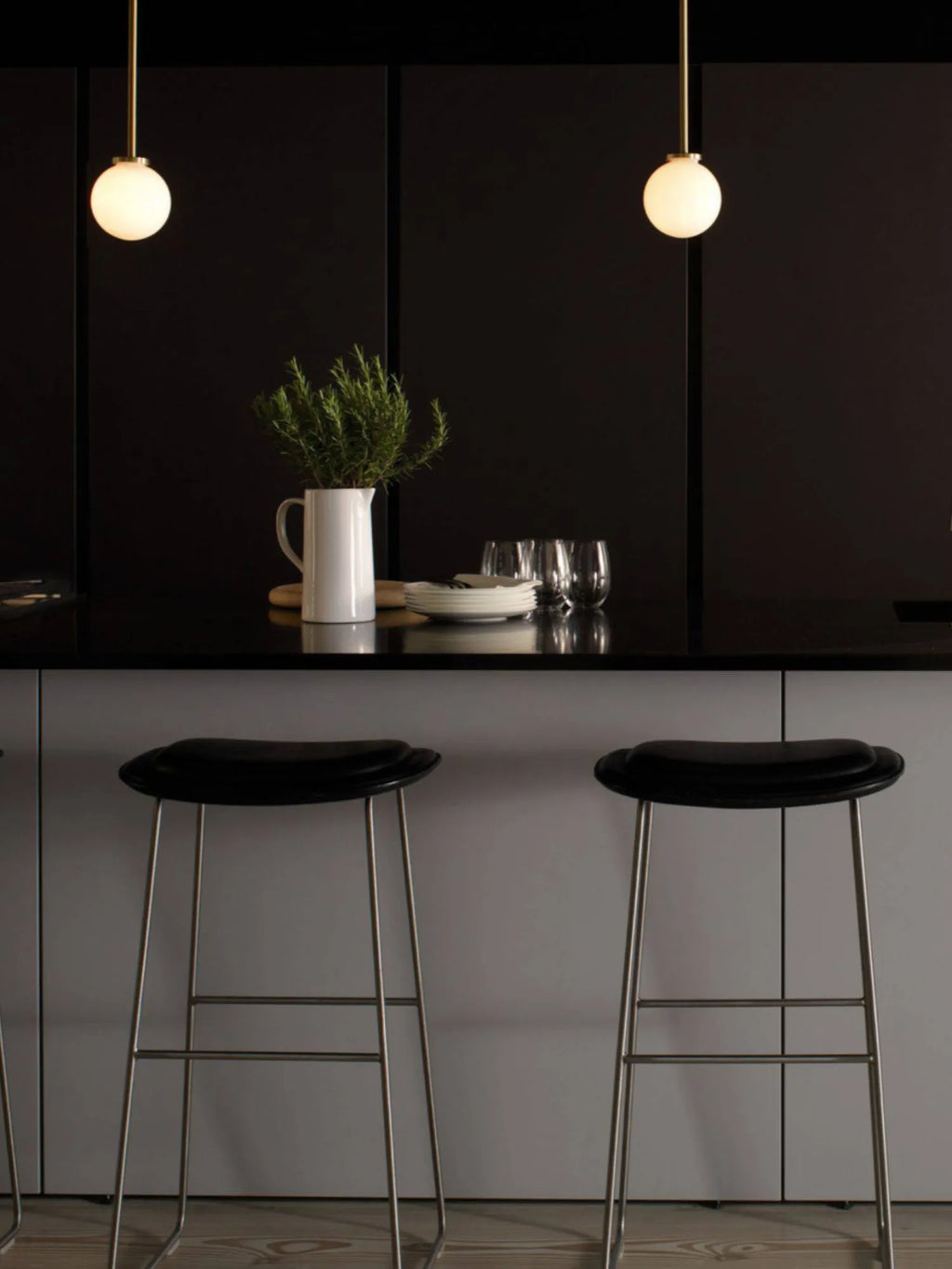 CTO Lighting Mezzo Pendant Lamp, a modern minimalist pendant light featuring a sleek brushed brass rod and a luminous spherical opal glass globe diffuser, offering soft, ambient illumination. This contemporary ceiling light is perfect for elegant kitchen island lighting, dining room accents, or Scandinavian-inspired spaces.