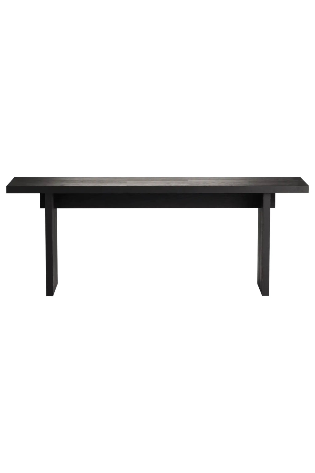 Tine K Koru Bench, a sleek modern minimalist bench crafted from dark charcoal solid wood with visible grain texture and a clean rectangular silhouette. This Scandinavian-inspired solid wood bench features thick, sturdy legs and a smooth top. Ideal as a contemporary dining bench or stylish entryway seating for organic modern interiors.