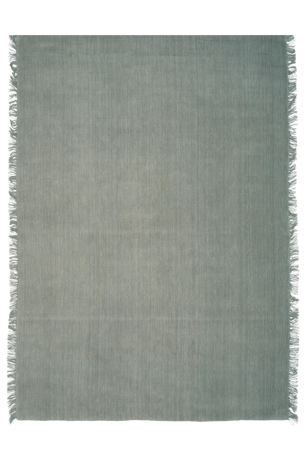 Linie Design Abyss Bliss Wool Rug, a premium hand-woven wool flatweave rug in a muted seafoam green with a subtle heathered texture and delicate fringed edges.