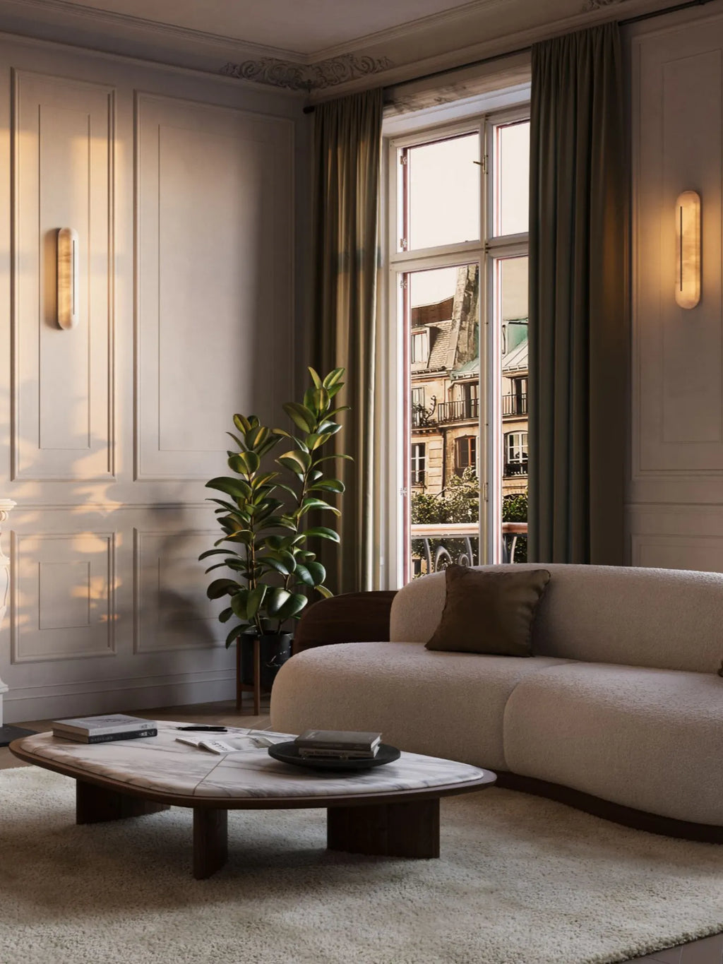 CTO Lighting Hepworth Tall Wall Light, a luxurious modern minimalist wall sconce featuring a translucent, elongated oval shade crafted from natural alabaster with subtle organic veining. The warm ivory stone emits a soft, diffused glow, enhancing its sleek vertical silhouette. Perfect for upscale living room wall lighting, bedroom accents, or elegant entryway illumination in contemporary and organic modern interiors.