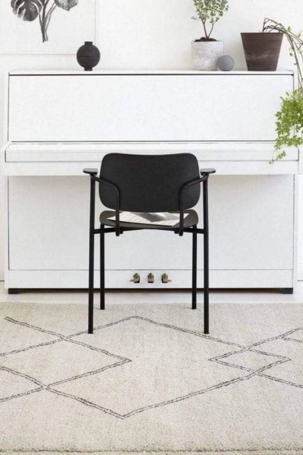 Sera Helsinki Kide Rug, a premium hand-knotted natural wool area rug in a soft, undyed cream hue featuring a plush, textured pile and a distinct dark gray geometric diamond pattern. This Moroccan-inspired rug brings a cozy, bohemian, or Scandinavian minimalist aesthetic, perfect for living rooms, bedrooms, or nurseries.