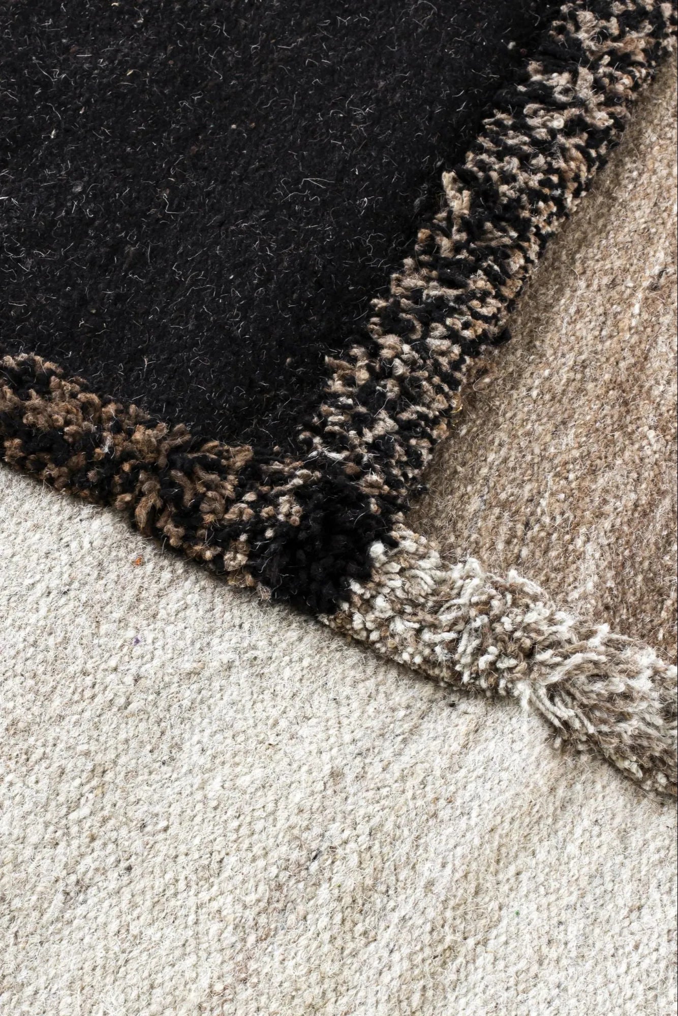 Sera Helsinki E-1027 Wool Rug, a premium hand-knotted wool area rug showcasing a unique textural design with contrasting pile heights and natural undyed color variations.