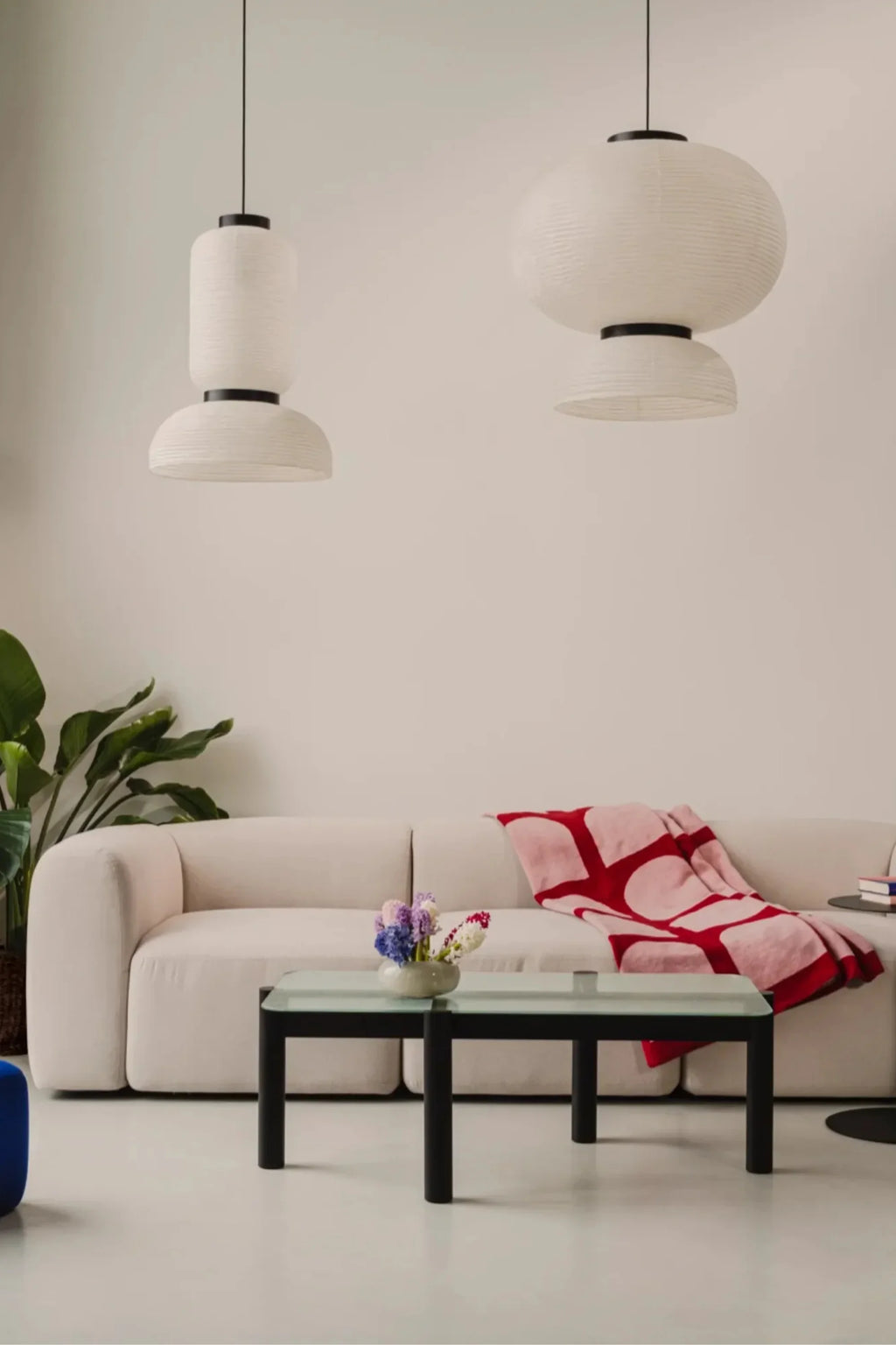 noo.ma Flom 3-Seater Sofa, a modern minimalist sofa upholstered in a light cream textured fabric with a gently curved, organic profile and plush, low-slung seating. This contemporary 3-seater sofa is perfect for Scandinavian living rooms and inviting minimalist spaces.