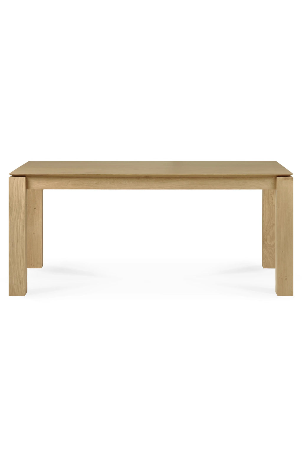 Ethnicraft Slice Dining Table, a modern minimalist rectangular dining table crafted from natural solid oak with a light finish and visible wood grain. Its clean, contemporary design features a subtly floating tabletop over sturdy rectangular legs, creating a refined aesthetic. Ideal for Scandinavian dining rooms, modern minimalist kitchens, or contemporary living spaces.