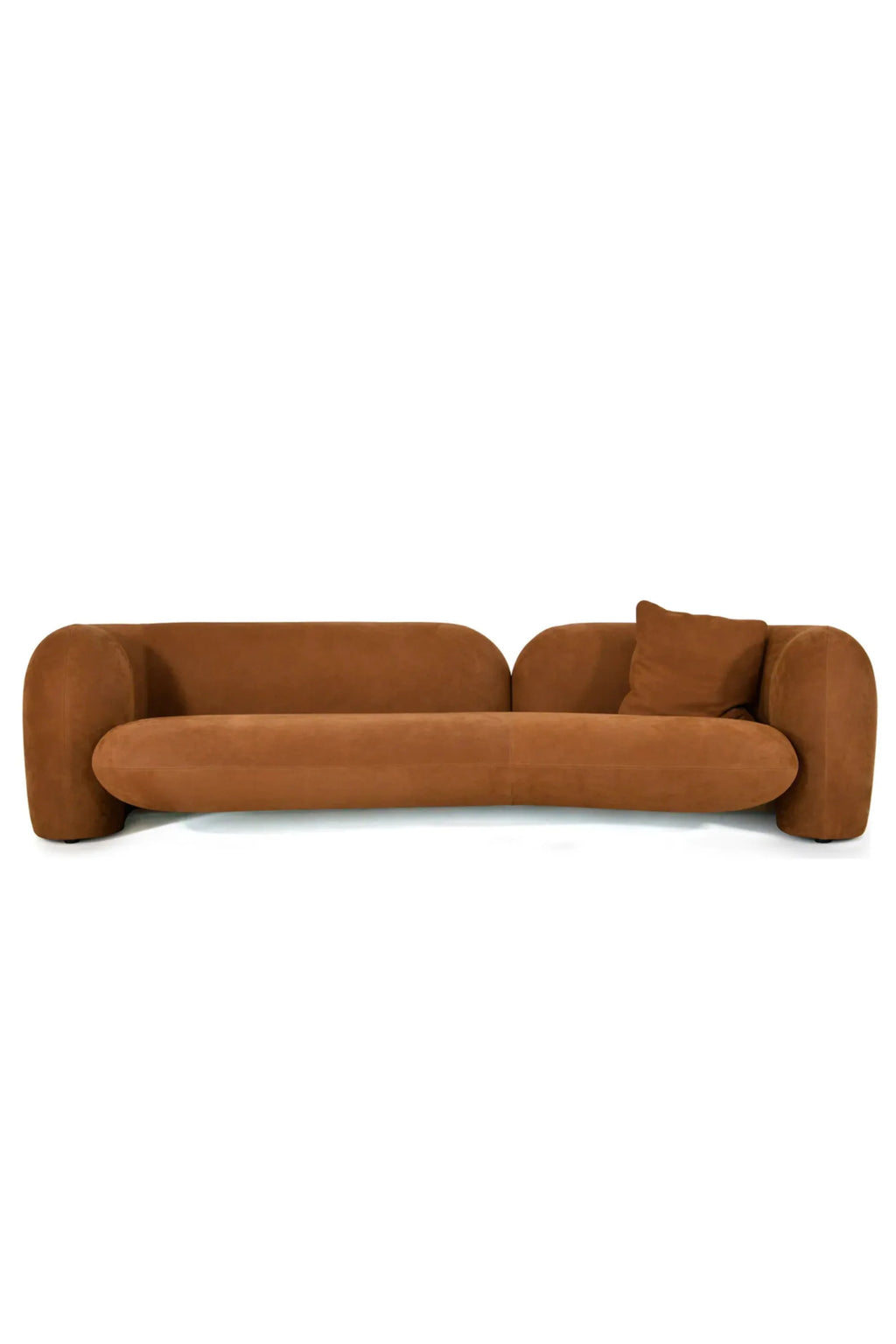 Hessentia Gio Curved Sofa, a luxurious organic modern sofa upholstered in a warm terracotta suede-like fabric, featuring a distinctive low-profile, sculptural curved silhouette, and plush rounded arms and backrest, complete with a matching accent pillow. This contemporary statement piece is perfect for a sophisticated living room or an inviting open-plan space.