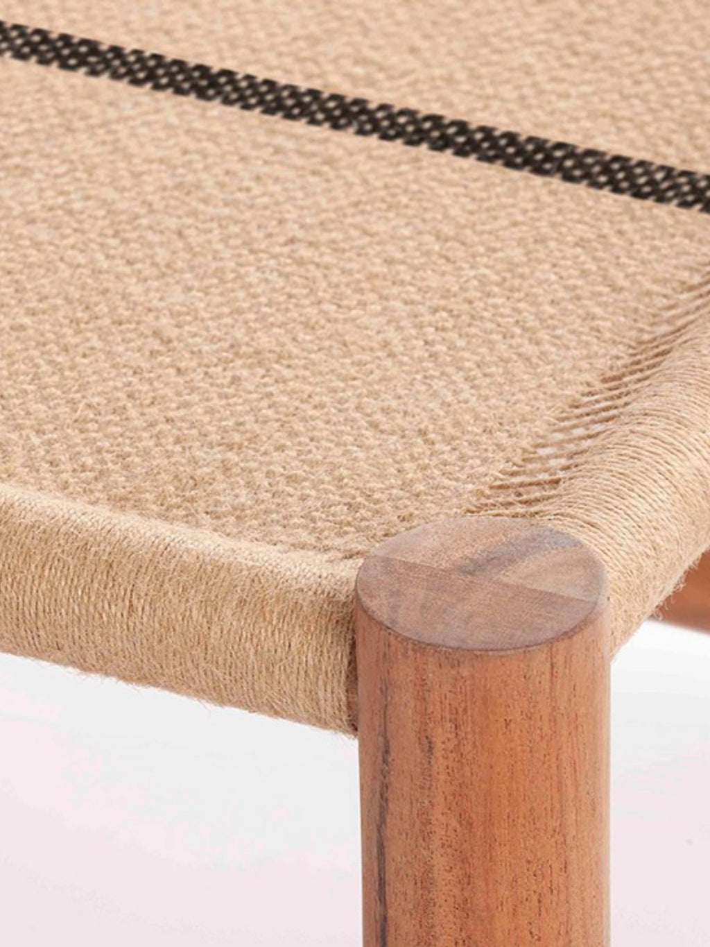 GAN Rugs Roots 01 Stool, a natural organic modern accent stool featuring a hand-woven jute seat in warm tan tones with a distinctive black stripe, supported by sturdy cylindrical solid wood legs with a rich reddish-brown finish. This rustic contemporary stool is perfect for adding natural texture and seating to living rooms, bedrooms, or entryways in Japandi and coastal-inspired interiors.