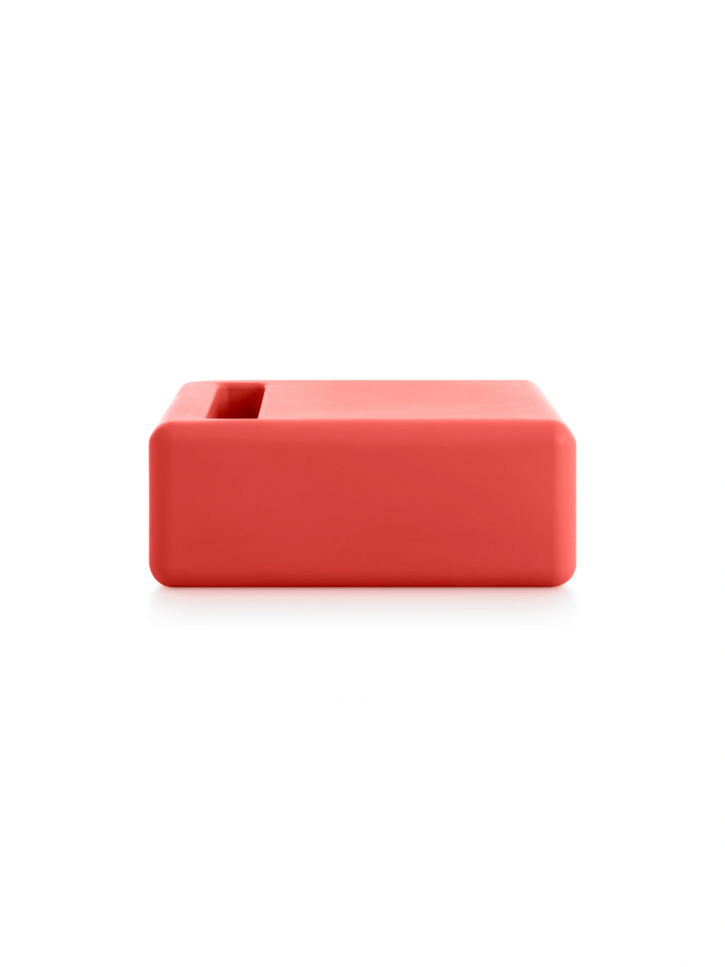 Diabla 365 Club Chair Table in vibrant red, exhibiting its bold, modern rectangular silhouette with smooth, curved corners and a functional central opening, set against a white background.