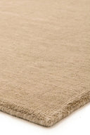Hand-woven Sana Wool Rug in neutral tones, perfect for adding cozy texture to any room